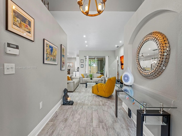 2021 SE 17th Ave, Homestead, FL 33035 - hall featuring a chandelier, wood finished floors, recessed lighting, and baseboards