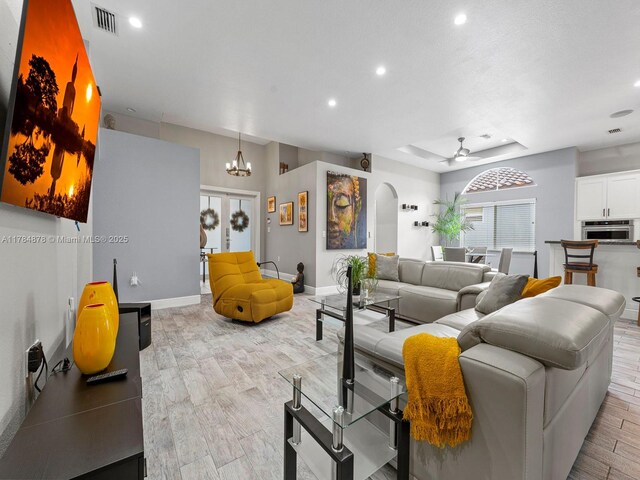 2021 SE 17th Ave, Homestead, FL 33035 - living area with recessed lighting, light wood-style floors, arched walkways, a ceiling fan, and baseboards