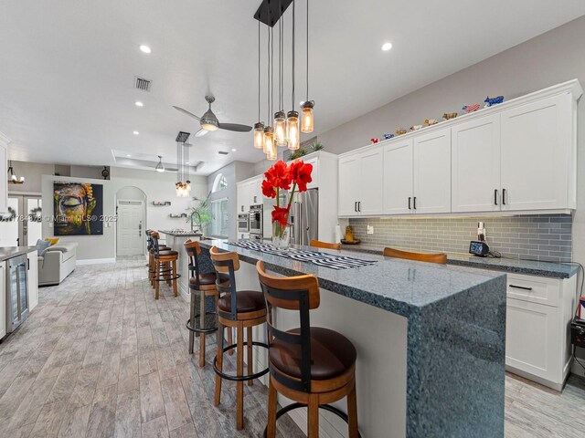 2021 SE 17th Ave, Homestead, FL 33035 - kitchen featuring stainless steel appliances, tasteful backsplash, recessed lighting, light wood-style flooring, and white cabinets