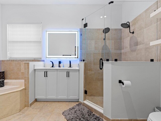 2021 SE 17th Ave, Homestead, FL 33035 - full bathroom featuring a shower stall, a bath, vanity, toilet, and tile patterned floors