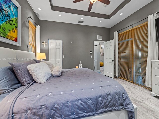 2021 SE 17th Ave, Homestead, FL 33035 - bedroom featuring a raised ceiling, wood finished floors, recessed lighting, ceiling fan, and access to exterior