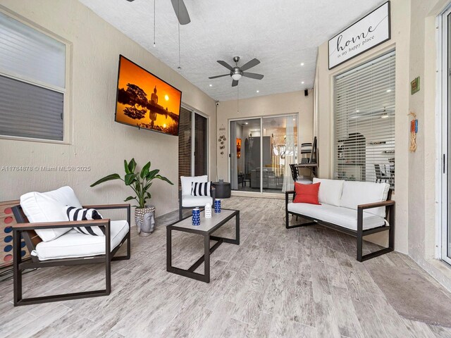 2021 SE 17th Ave, Homestead, FL 33035 - living area featuring a ceiling fan, wood finished floors, a textured ceiling, and recessed lighting