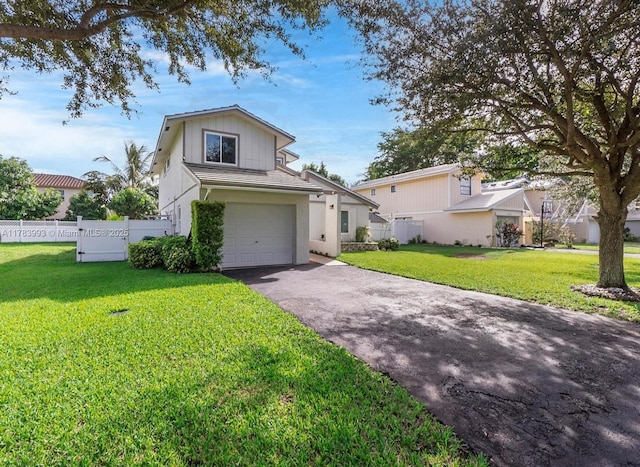 10560 La Placida Dr, Coral Springs, FL 33065 - view of front of property featuring asphalt driveway and an attached garage