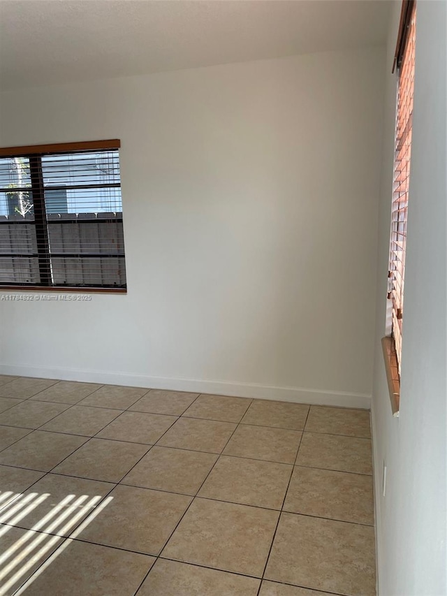 271 NW 57th Ct, Miami, FL 33126 - unfurnished room with tile patterned floors and baseboards