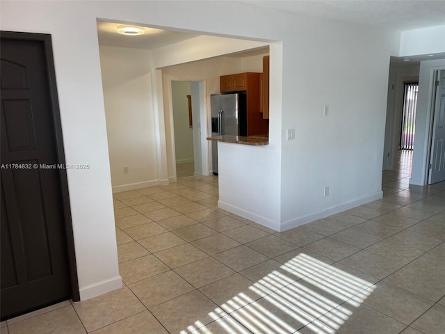 271 NW 57th Ct, Miami, FL 33126 - unfurnished room with light tile patterned floors and baseboards