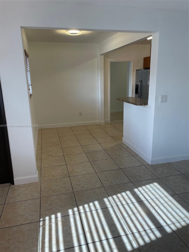 271 NW 57th Ct, Miami, FL 33126 - empty room featuring light tile patterned floors and baseboards