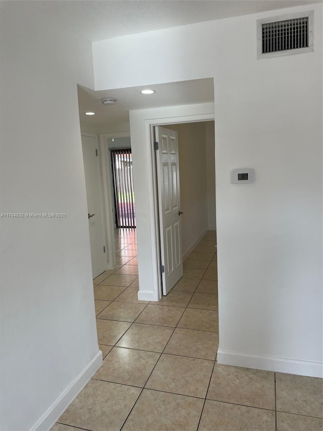 271 NW 57th Ct, Miami, FL 33126 - hallway featuring light tile patterned floors, baseboards, visible vents, and recessed lighting
