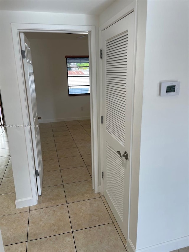 271 NW 57th Ct, Miami, FL 33126 - corridor with light tile patterned floors and baseboards