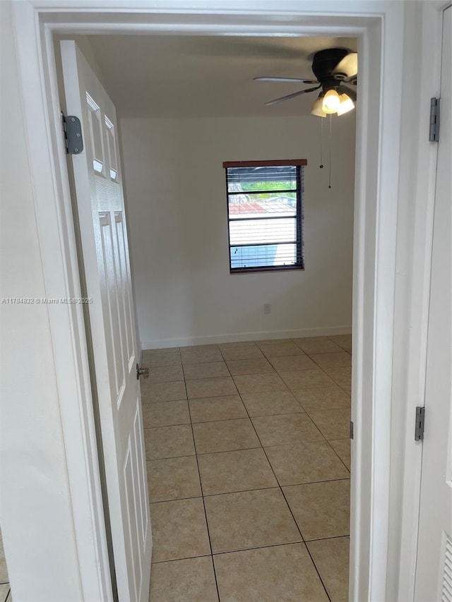 271 NW 57th Ct, Miami, FL 33126 - empty room featuring light tile patterned flooring, ceiling fan, and baseboards