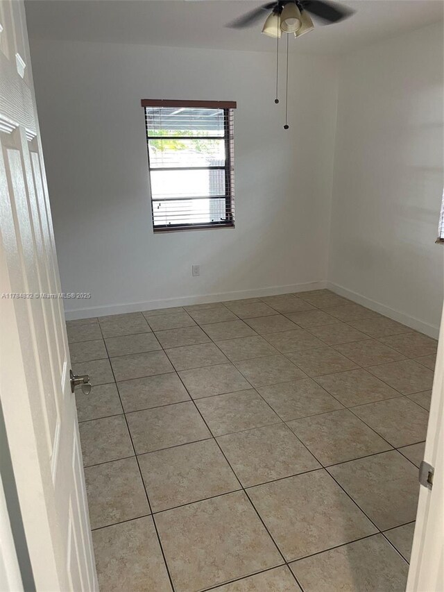 271 NW 57th Ct, Miami, FL 33126 - unfurnished room with light tile patterned floors, baseboards, and a ceiling fan