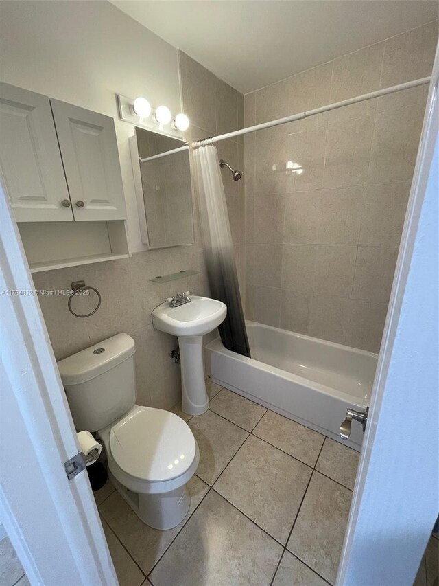 271 NW 57th Ct, Miami, FL 33126 - bathroom featuring tile patterned flooring, shower / tub combo with curtain, a sink, and toilet