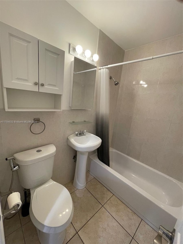 271 NW 57th Ct, Miami, FL 33126 - bathroom featuring toilet, shower / bath combo with shower curtain, a sink, and tile patterned flooring