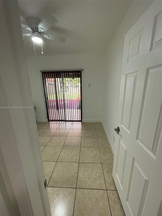 271 NW 57th Ct, Miami, FL 33126 - empty room with ceiling fan, baseboards, and light tile patterned flooring