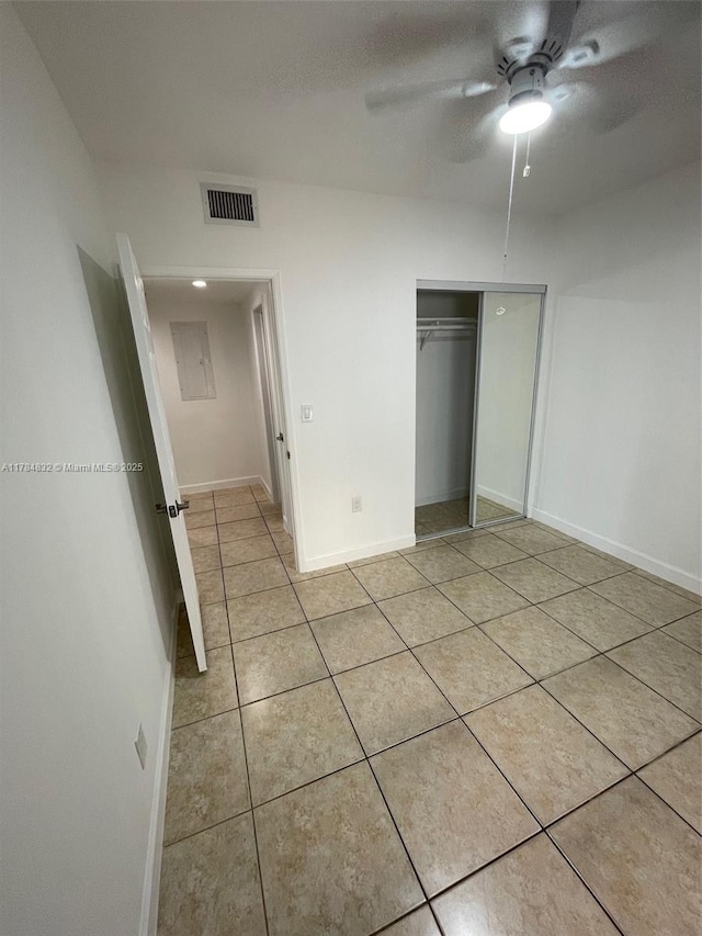 271 NW 57th Ct, Miami, FL 33126 - unfurnished bedroom featuring visible vents, baseboards, a closet, and light tile patterned flooring