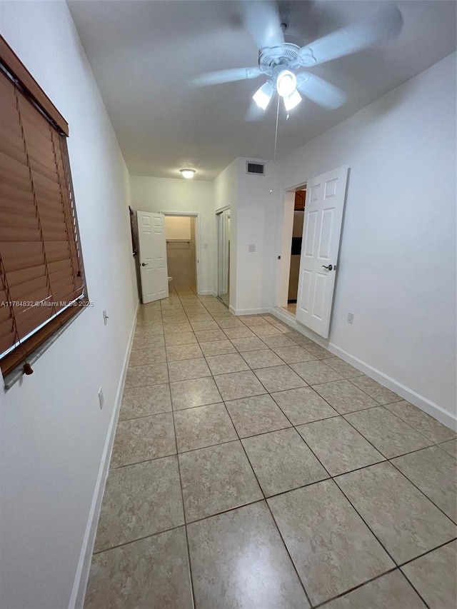 271 NW 57th Ct, Miami, FL 33126 - interior space featuring light tile patterned floors, baseboards, a ceiling fan, and visible vents