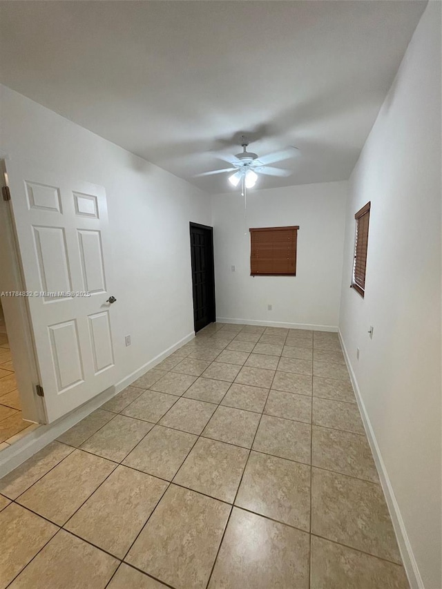 271 NW 57th Ct, Miami, FL 33126 - spare room featuring baseboards, a ceiling fan, and light tile patterned flooring