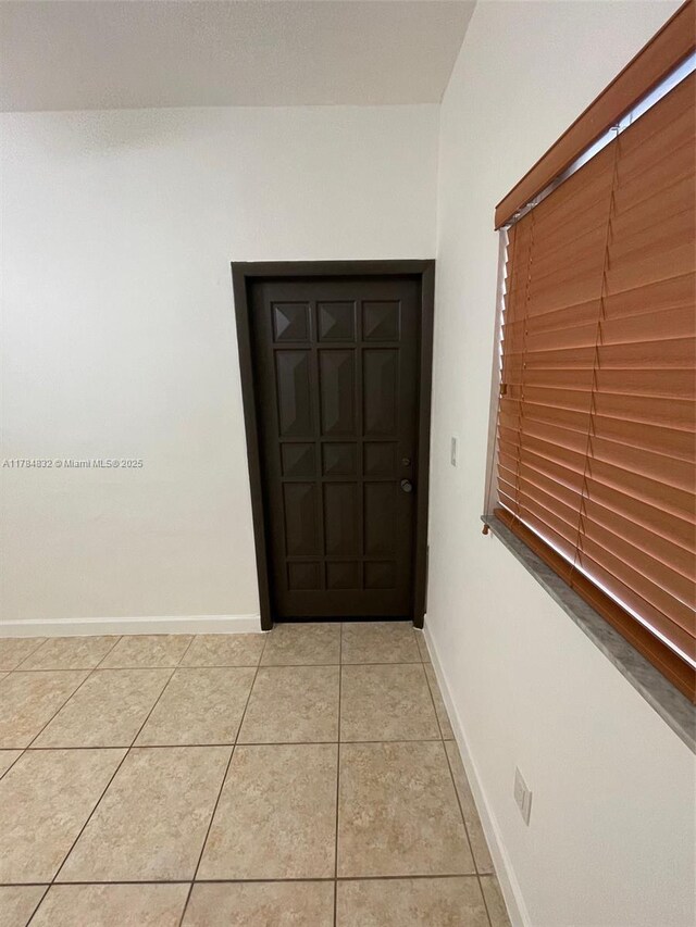 271 NW 57th Ct, Miami, FL 33126 - interior space with light tile patterned floors and baseboards