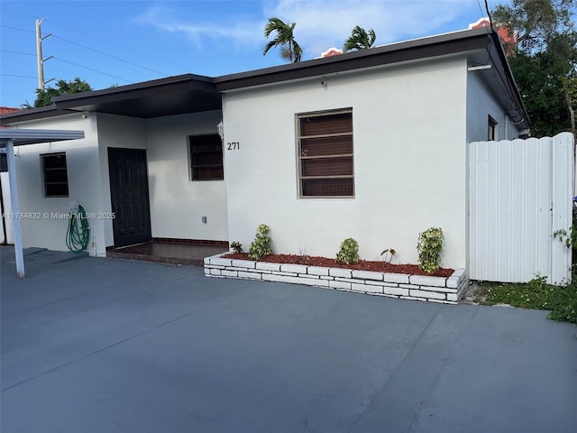 271 NW 57th Ct, Miami, FL 33126 - bungalow featuring a patio, stucco siding, and fence
