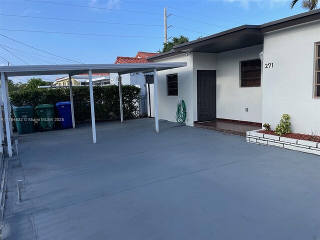 271 NW 57th Ct, Miami, FL 33126 - view of patio with a carport