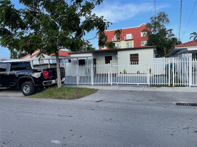 271 NW 57th Ct, Miami, FL 33126 - view of front of house featuring a gate and a fenced front yard