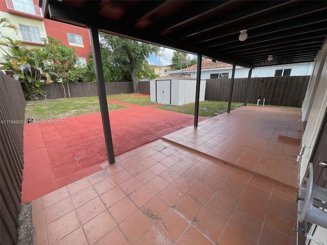 271 NW 57th Ct, Miami, FL 33126 - view of patio featuring a shed, a fenced backyard, and an outdoor structure