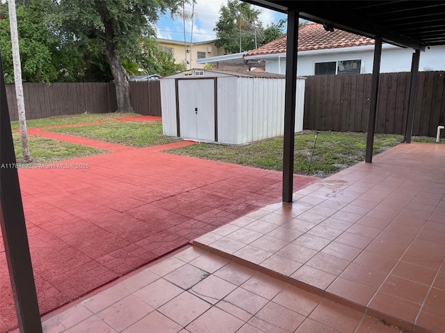 271 NW 57th Ct, Miami, FL 33126 - view of patio / terrace with a shed, a fenced backyard, and an outdoor structure