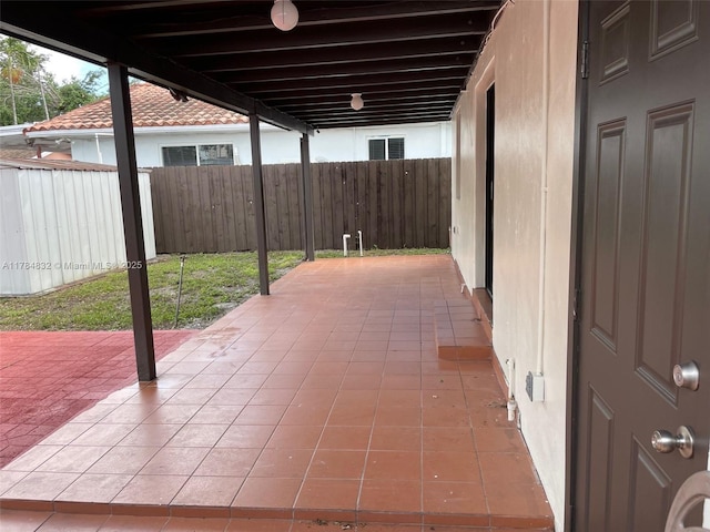 271 NW 57th Ct, Miami, FL 33126 - view of patio featuring a fenced backyard