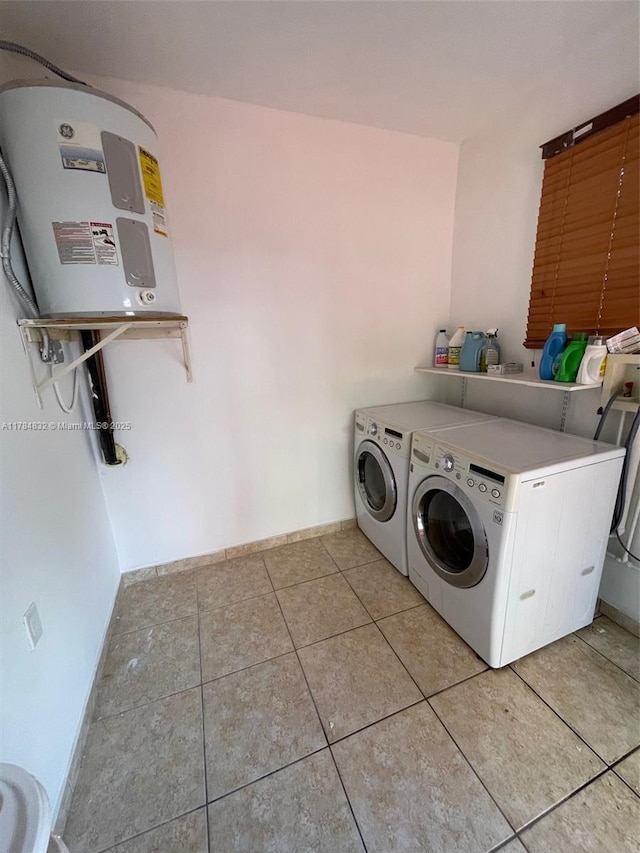 271 NW 57th Ct, Miami, FL 33126 - laundry room featuring light tile patterned floors, washing machine and dryer, laundry area, and baseboards
