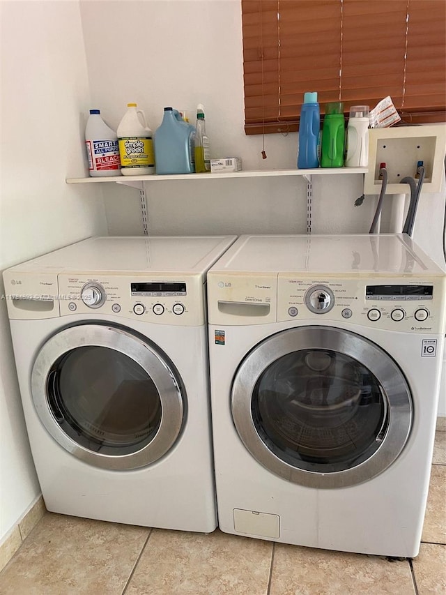 271 NW 57th Ct, Miami, FL 33126 - clothes washing area with light tile patterned floors, washer and dryer, and laundry area