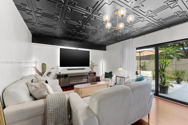 7707 77th Way, West Palm Beach, FL 33407 - living area with an ornate ceiling, a chandelier, and wood finished floors