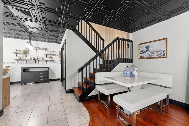 7707 77th Way, West Palm Beach, FL 33407 - stairs featuring an ornate ceiling and baseboards