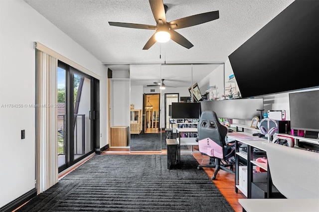 7707 77th Way, West Palm Beach, FL 33407 - office space featuring ceiling fan, a textured ceiling, wood finished floors, and baseboards