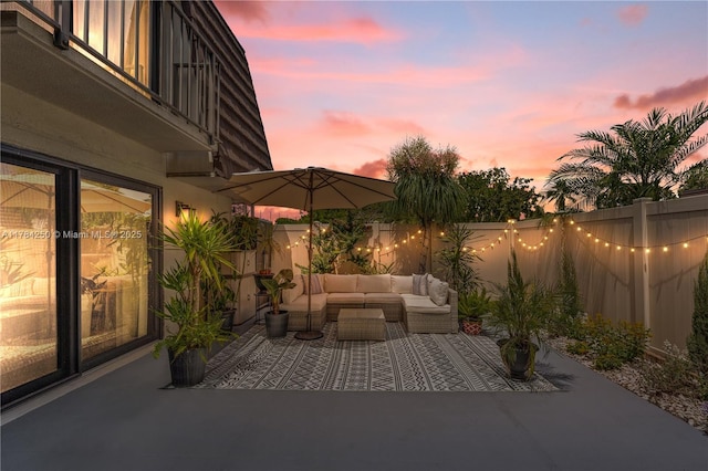 7707 77th Way, West Palm Beach, FL 33407 - fenced backyard with outdoor lounge area and a patio area
