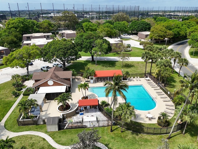 7707 77th Way, West Palm Beach, FL 33407 - drone / aerial view of a pool area and a tree filled landscape