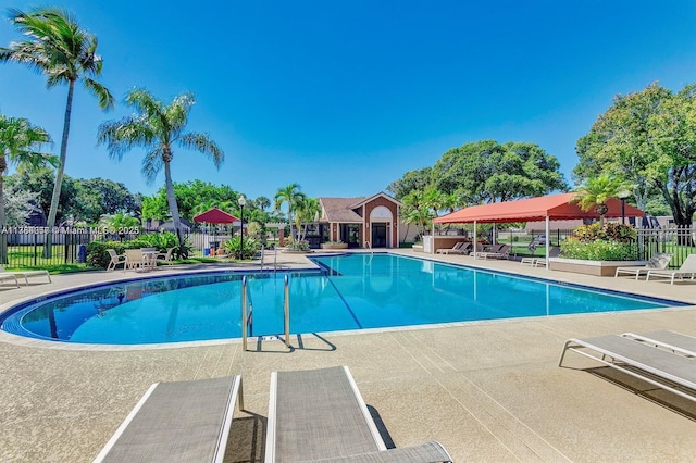 7707 77th Way, West Palm Beach, FL 33407 - community pool with a patio area