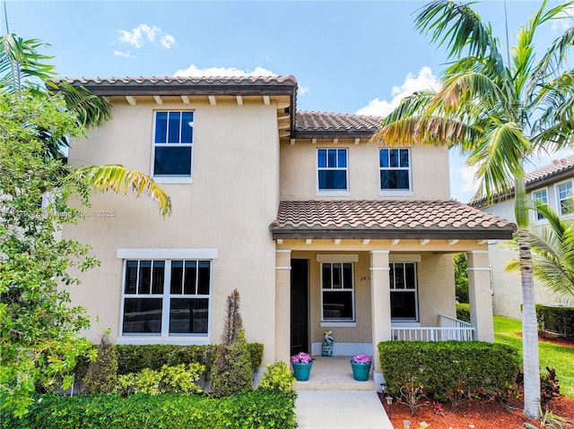 24362 SW 117th Path, Homestead, FL 33032 - mediterranean / spanish home featuring a tiled roof, covered porch, and stucco siding