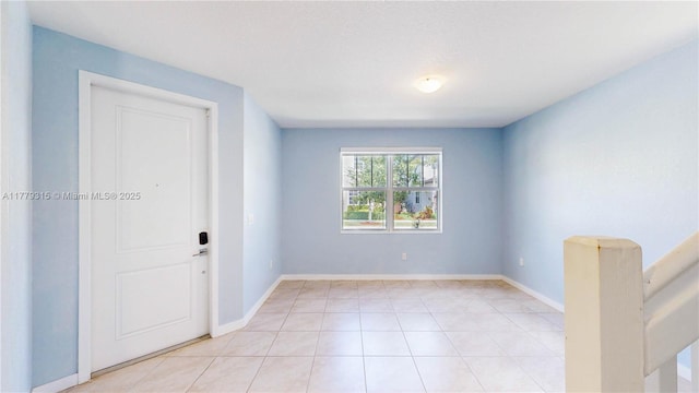 24362 SW 117th Path, Homestead, FL 33032 - unfurnished room with baseboards and light tile patterned floors