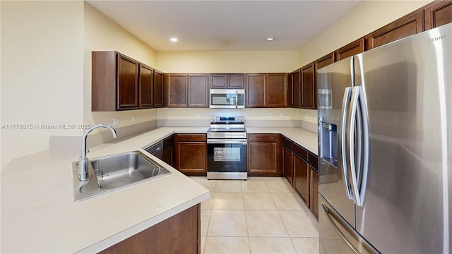 24362 SW 117th Path, Homestead, FL 33032 - kitchen featuring light tile patterned flooring, recessed lighting, light countertops, a sink, and stainless steel appliances