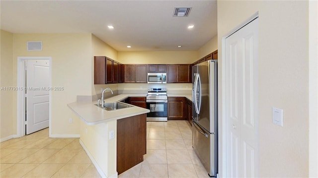 24362 SW 117th Path, Homestead, FL 33032 - kitchen with a sink, appliances with stainless steel finishes, a peninsula, and visible vents
