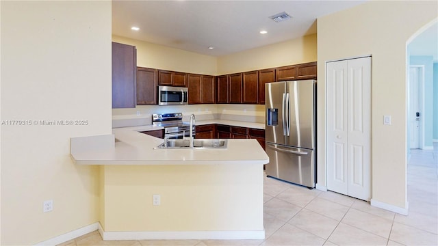 24362 SW 117th Path, Homestead, FL 33032 - kitchen featuring visible vents, arched walkways, a sink, a peninsula, and stainless steel appliances