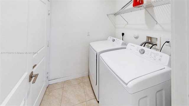 24362 SW 117th Path, Homestead, FL 33032 - laundry room with laundry area, baseboards, light tile patterned floors, and washing machine and clothes dryer