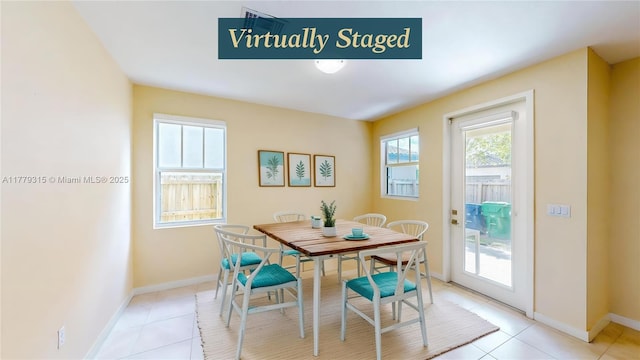 24362 SW 117th Path, Homestead, FL 33032 - dining area featuring baseboards and light tile patterned floors