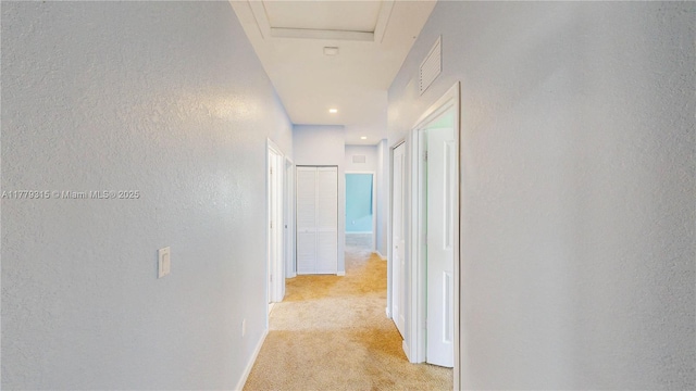 24362 SW 117th Path, Homestead, FL 33032 - hallway with baseboards, a textured wall, visible vents, and light carpet