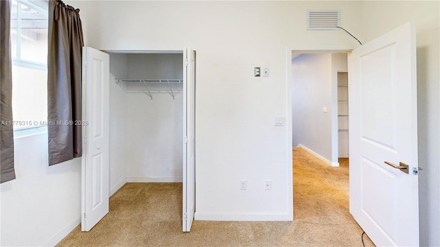 24362 SW 117th Path, Homestead, FL 33032 - unfurnished bedroom featuring baseboards, light colored carpet, visible vents, and a closet