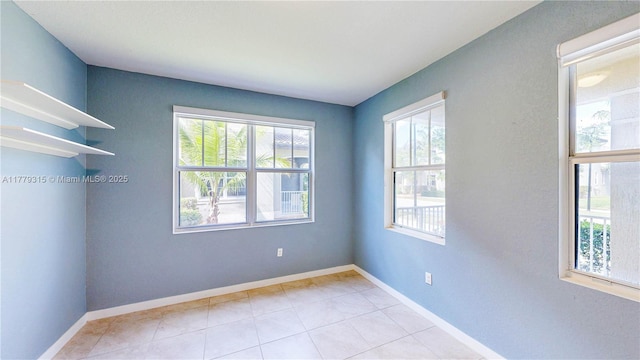 24362 SW 117th Path, Homestead, FL 33032 - tiled empty room featuring baseboards