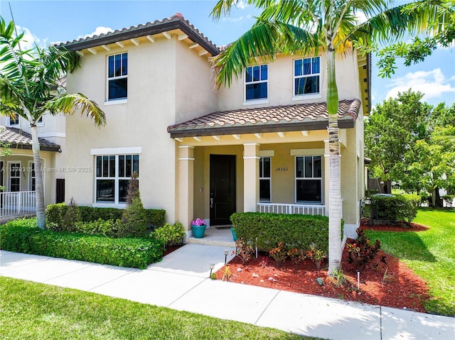 24362 SW 117th Path, Homestead, FL 33032 - mediterranean / spanish-style home featuring covered porch, a tiled roof, and stucco siding