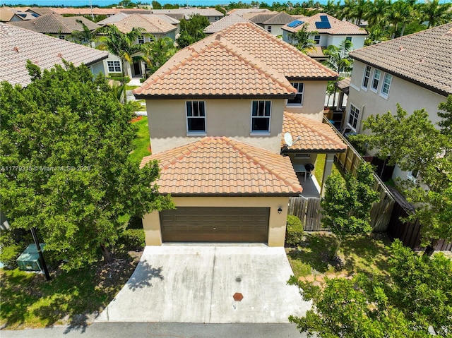 24362 SW 117th Path, Homestead, FL 33032 - mediterranean / spanish home featuring concrete driveway, a residential view, a tile roof, and stucco siding