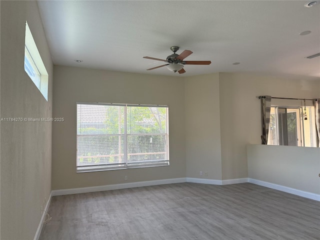 5352 NW 57th Ter, Coral Springs, FL 33067 - unfurnished room featuring wood finished floors, a ceiling fan, and baseboards