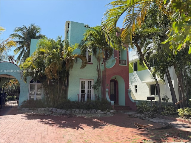 1722 Jefferson Ave, Miami Beach, FL 33139 - view of front of property featuring french doors, a gate, and stucco siding