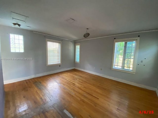 1722 Jefferson Ave, Miami Beach, FL 33139 - empty room with baseboards and wood finished floors